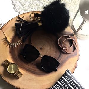 Black and gold cat eye sunglasses